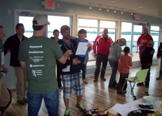 Volunteers receive Onondaga Lake Conservation Corps certificates from Frank Moses, director of Montezuma Audubon Center.