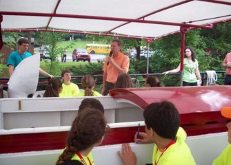 New York State Senator David J. Valesky welcomes students on the Emita II before the boat leaves the dock.