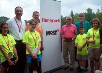 On hand to welcome students are, from left, Honeywell Syracuse Program Director John McAuliffe, Senator Valesky, MOST President Larry Leatherman, and MOST Exhibits Project Manager Peter Plumley, Ph.D.