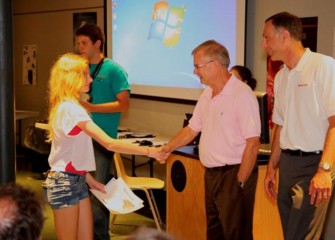 MOST President Larry Leatherman congratulates students as they receive completion certificates and become “MOST Associates,” granting them free entry to the museum for the next year.