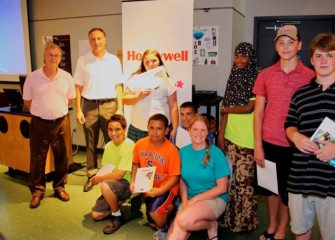 Students, who came from nine different school districts this year,  pose for  group photos with their Summer Science Week teams and new friends before departing.