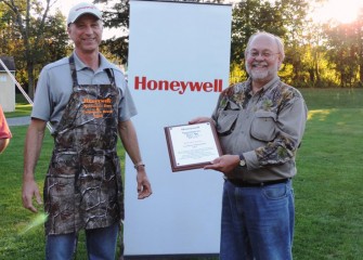 Onondaga County Federation of Sportsmen’s Clubs President Stephen Wowelko (right) thanks Honeywell for its continued partnership.