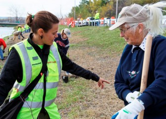 Natalia Cagide-Elmer, SUNY-ESF teaching assistant and Parsons intern, works with volunteer Barbara Sleight to pick a good spot for a young tree.