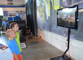 Children watch an educational video about progress restoring the natural beauty of Onondaga Lake and its adjacent habitats.