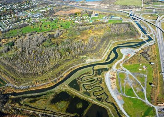 Geddes Brook and its new meandering form is seen in relation to Nine Mile Creek, which flows into Onondaga Lake (background).