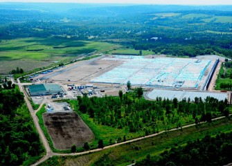 The water treatment plant, processing area (middle) and consolidation area are visible. Dredged lake material is being safely isolated long term within the consolidation area.