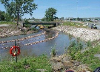 Excavation takes place in Nine Mile Creek under the I-695 exit ramp bridge to Pumphouse Road, in Geddes.