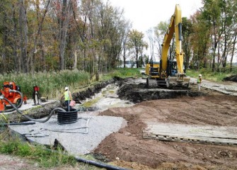 Sediments are removed and replaced with local shale fill, a reddish clay-like soil that will help retain rainfall moisture for the wetland plants.