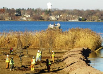 Planting begins at the Nine Mile Creek forested wetland. The Village of Liverpool is across Onondaga Lake.