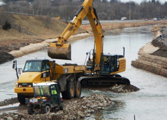 Access road stone is recaptured to reuse further down Nine Mile Creek.