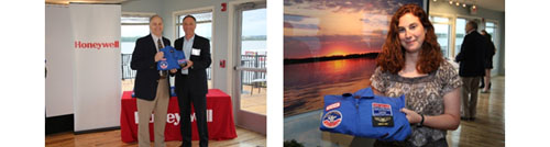 Honeywell Syracuse Program Director John McAuliffe presents 2014<span style="font-style:italic;"> Honeywell Educators @ Space Academy</span> teachers with their flight suits: teachers Greg Flick (left) and Carolyn Scott (right).