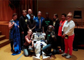 Former NASA astronaut Donald Thomas, Ph.D. (center) attends a gathering of 6th grade students and science club members at Lincoln Middle School in Syracuse in conjunction with Honeywell Educators @ Space Academy.