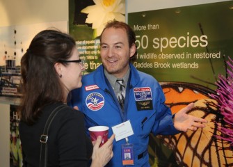 Honeywell Educator Kay Frizzell (left), from Danforth Middle School, visits with Space Academy 2013 alumnus Scott Macomber.