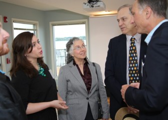 Honeywell Syracuse Program Director John McAuliffe (right) meets earth science teacher Greg Flick (2nd from right) and other guests before the recognition event.