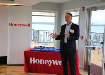 John McAuliffe welcomes the Class of 2014 Honeywell Educators @ Space Academy at the beginning of the recognition ceremony.