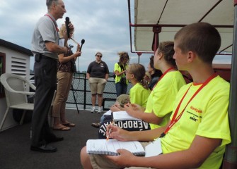 Honeywell Syracuse Program Director John McAuliffe talks about the Onondaga Lake cleanup.  Students record notes and first-hand observations in their handbooks throughout the week.