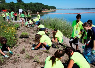 On “Honeywell Day,” students gather at the Onondaga Lake Visitors Center to learn about the Onondaga Lake cleanup and plant native plants near the Onondaga Lake shoreline.