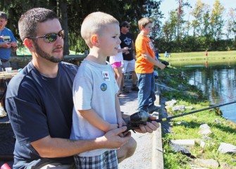 Nicholas Majerus of Cicero eagerly waits for a fish to bite on his line with his father, David Majerus.