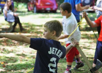 Jacob Murray from Fulton winds back before the throw while keeping his eye on the target.