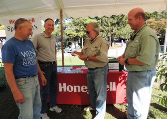 Stephen Wowelko, 2014 recipient of the Honeywell Hometown Heroes Award, checks out one of the free lures Honeywell provided to Sportsmen’s Days participants.