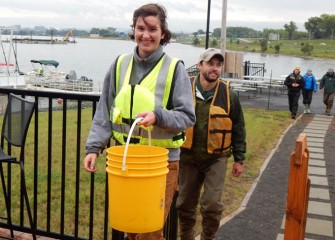 SUNY-ESF graduate students at the Onondaga Lake Visitors Center with fish collected from Onondaga Lake.