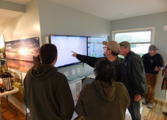 Inside the Visitors Center, experts and community members watch a live feed at inaturalist.org as species found during the 24-hour BioBlitz are recorded.