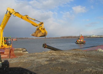 A pipe is removed as work on the lake concludes for the season.