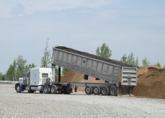 Sand is stockpiled for capping the lake bottom.