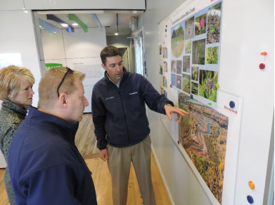 "We're so excited to be here, to see these images and to see the rejuvenation of the lake. We grew up here and it is absolutely unbelievable and amazing that in our lifetimes we will see this lake returned to the community as an asset," said Sue and Steve Koegel of Westvale, New York. The couple learns about habitat improvements from Mark Arrigo, Parsons habitat expert, pictured above (right). 