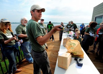 Participants gather on the deck at the Onondaga Lake Visitors Center to begin building bird nest boxes, or “birdhouses.”