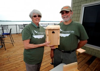 Onondaga Lake Conservation Corps volunteers Cheryl and Robert Belle, from Plainville, with the Tree Swallow box they assembled. Tree Swallows prefer to nest in a open area such as near wetlands or a lake.