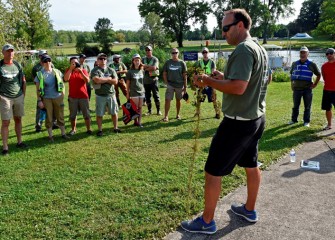 Tim Johnson, Senior Managing Scientist at Anchor QEA, shows volunteers how to identify European water chestnut.