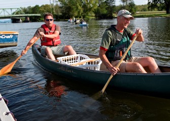 Ed Glaza (left), Senior Project Manager at Parsons, and John McAuliffe, Honeywell Syracuse Program Director, push off from the dock.