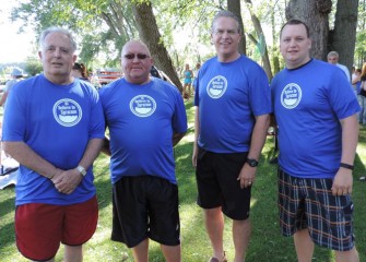 Enjoying the festivities before swimming are (from left) Solvay mayor Ron Benedetti, Geddes Town Supervisor Manny Falcone, County Legislator Tim Burtis and East Syracuse Mayor Robert Tackman.