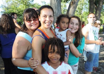 Amybeth Nyadedzor (center), from Syracuse, brought daughters Kayli (left), Solomae, and Soleil (right), and son Senyo (front) to be part of the “historic” day.