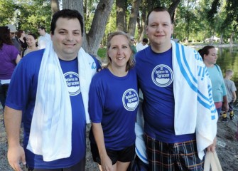 From left:  Believe in Syracuse President John DeSantis (left), Leadership Greater Syracuse Executive Director Pam Brunet, and East Syracuse Mayor Robert Tackman enjoy the continuing celebration in Onondaga Lake Park.