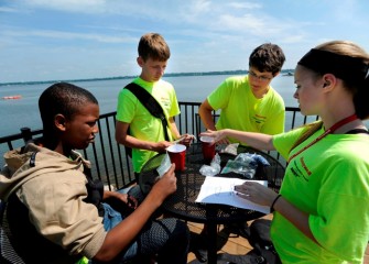 Students learn about capping in Onondaga Lake, which continues through 2016, by performing a hands-on experiment.