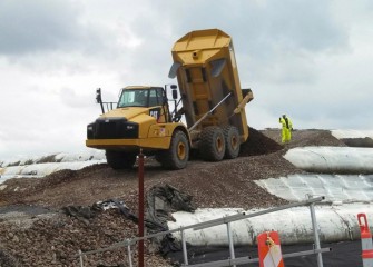 An access road is built up onto the filled geotubes.