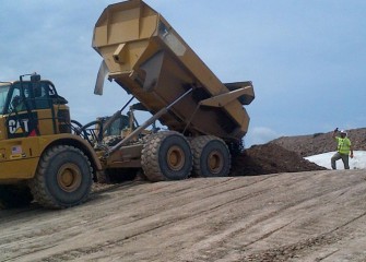Fill is placed on top of the geotubes to create the leveling layer.