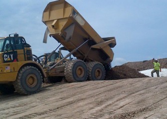 Fill is placed on top of the geotubes to create the leveling layer.