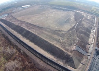 The leveling layer is complete for the 2015 construction season, and will settle over the winter.  Next year polyethylene liner will be placed on top and welded to the bottom liner, sealing off the lake material.