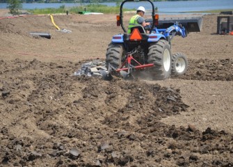 Topsoil is plowed to facilitate plant installation.