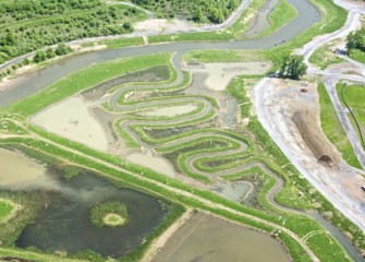 Water from Geddes Brook spills into wetland areas as designed during high water periods.