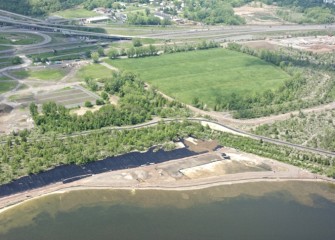 Liner is placed along sections of the Western Shoreline before clean sand and topsoil are brought in.