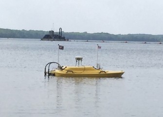 The Z-boat uses GPS and sonar to collect data on the cap below.  Measurements are available by radio link to the team on shore, and used to create 3-dimensional images of the lake bottom.