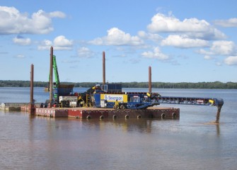 The telestacker is used to place topsoil in a shallow area.