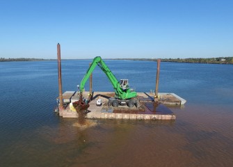 Finer material settles more slowly to the bottom than heavier material.  The capping material is creating a new habitat layer for the lake bottom.