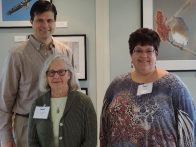 The exhibit featured images taken by local photographers (left to right) Greg Craybas, Cheryl Lloyd, and Michele Neligan. Not pictured: Suzanne Ray, Jonathan Kresge, and John Savage.