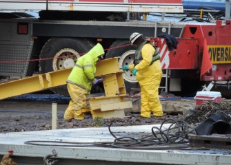 Barges are disassembled and equipment winterized for storage at the end of the construction season.