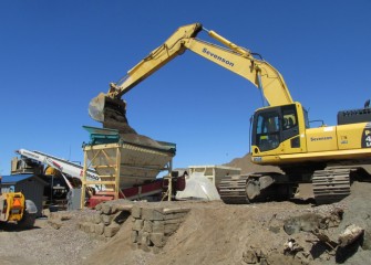 Sand is loaded into a hopper before travelling up a weigh belt, a conveyor belt that measures the quantity of material.
